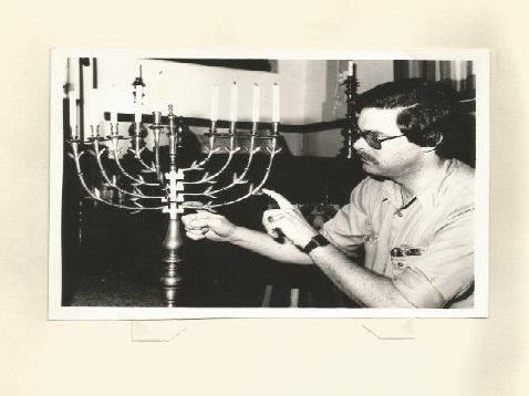 Jan van Arkel pictured with menorah he found hidden in the floorboards of a former synagogue in the Netherlands 